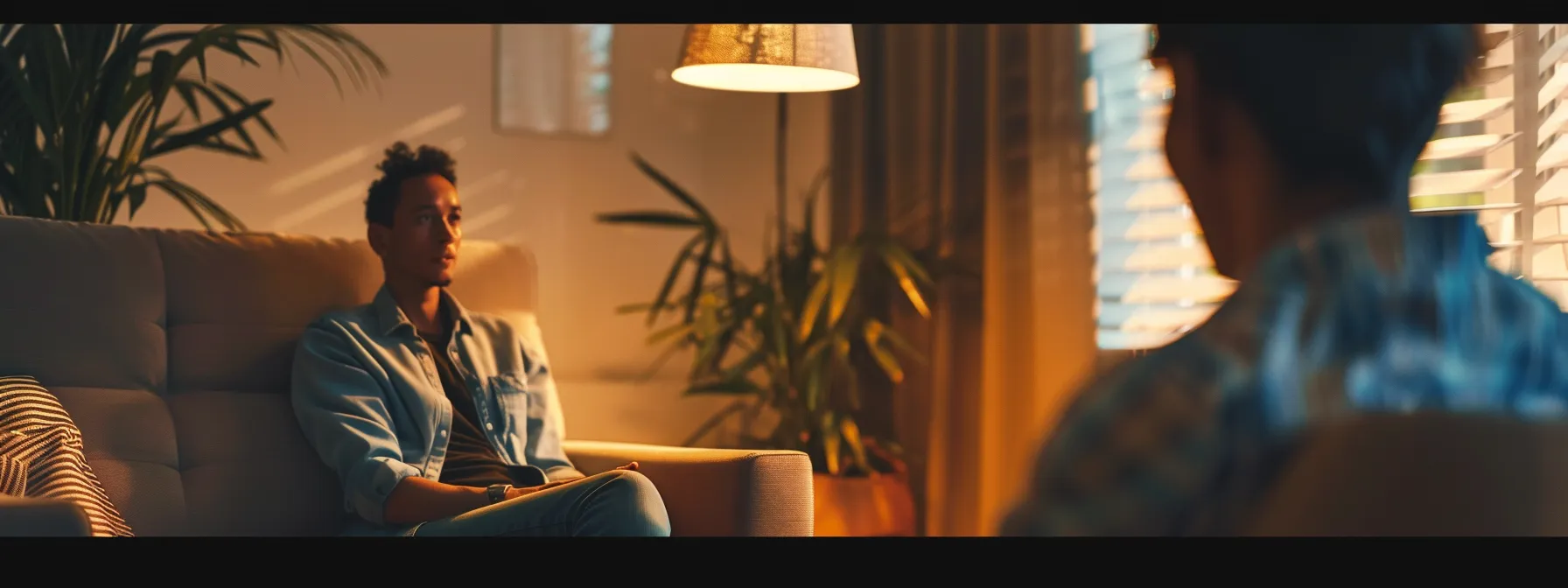 a person sitting in a cozy room, talking to their therapist with a look of trust and understanding.